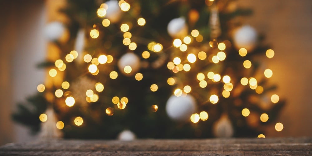 Christmas Background. Rustic Wood On Background Of Christmas Tree  Lights Golden Bokeh. Space For Te