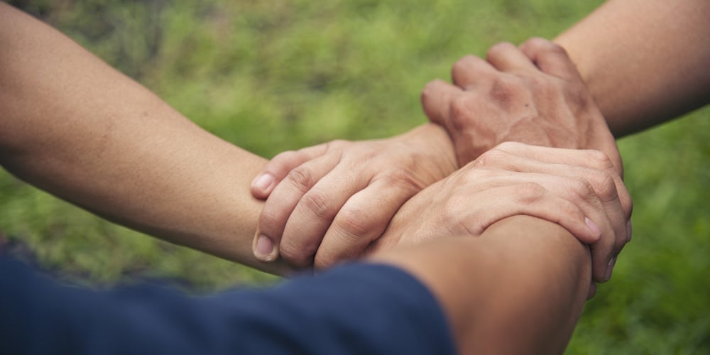 Close Up Hands Diverse Multiethnic Partners Team Together. Teamwork Group Of Multi Racial People Mee