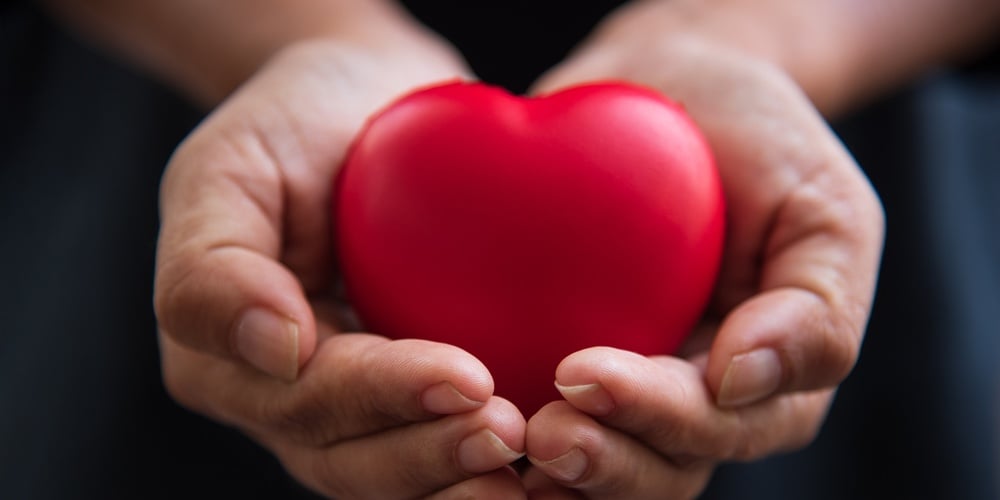 bigstock-Close-Up-Hands-Giving-Red-Hear-263415898