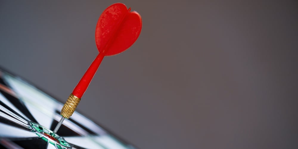 Close Up Shot Red Darts Arrows In The Target Center On Dark Background. Business Target Or Goal Succ