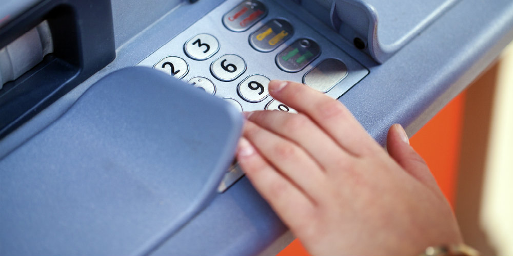 bigstock-Close-up-of-hand-entering-pin–159649031