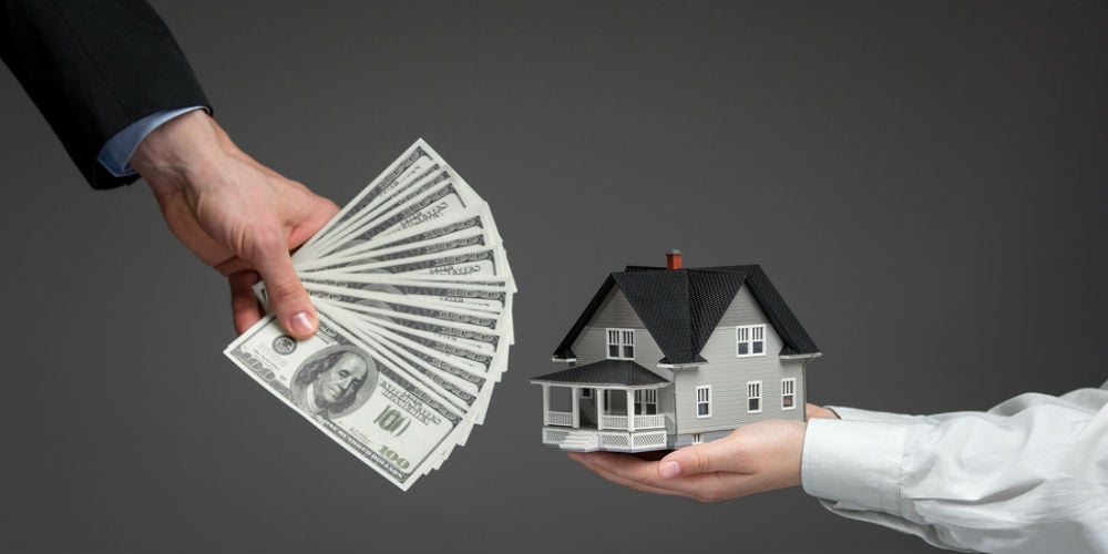 bigstock-Close-up-of-hands-giving-house-54973082