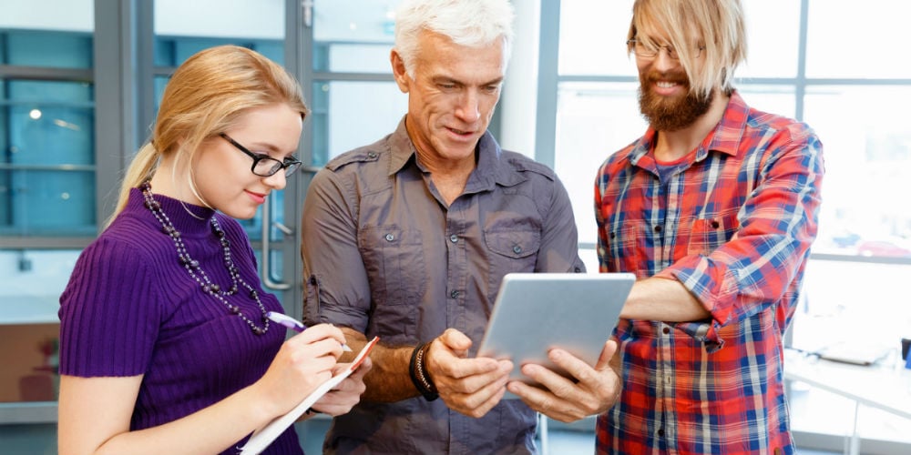 bigstock-Co-workers-working-together-124807913