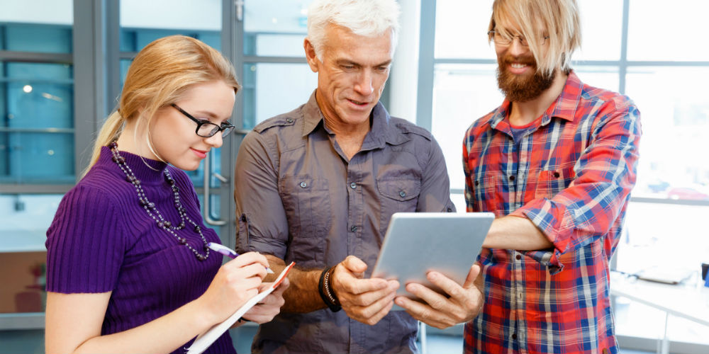 bigstock-Co-workers-working-together-124807913