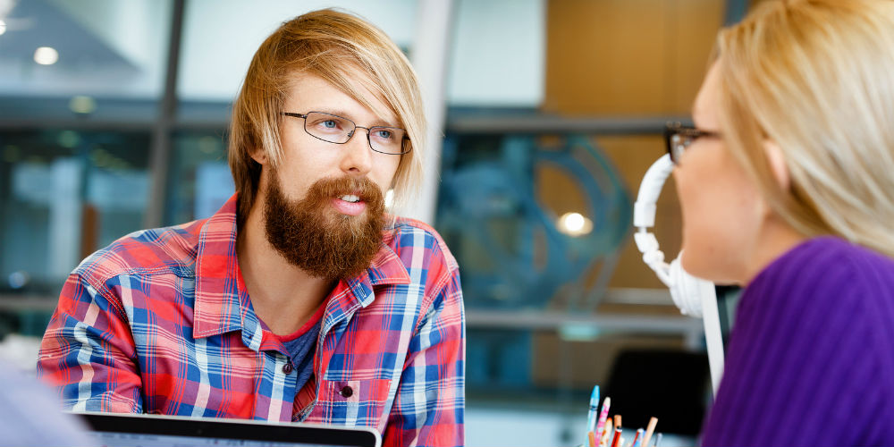 bigstock-Co-workers-working-together-191537848