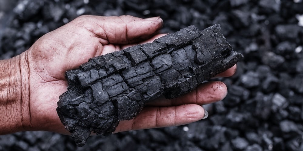 Coal Mining – Man Hand Holding Natural Black Charcoal For Background. Picture Idea About Coal Mining