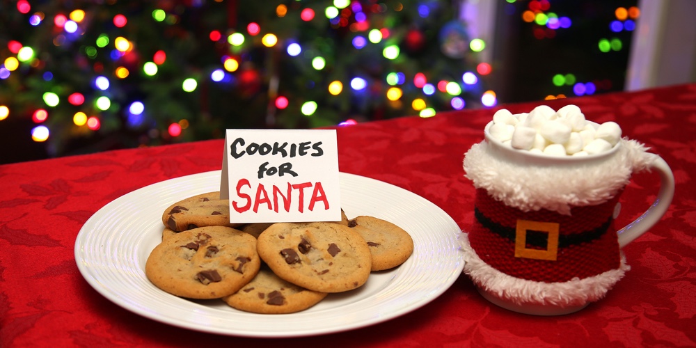Cookies for Santa Claus. Fresh Baked Cookies and Hot Chocolate with Marshmallows left on a table for