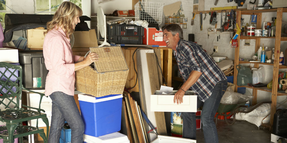 bigstock-Couple-Clearing-Garage-For-Yar-92342825