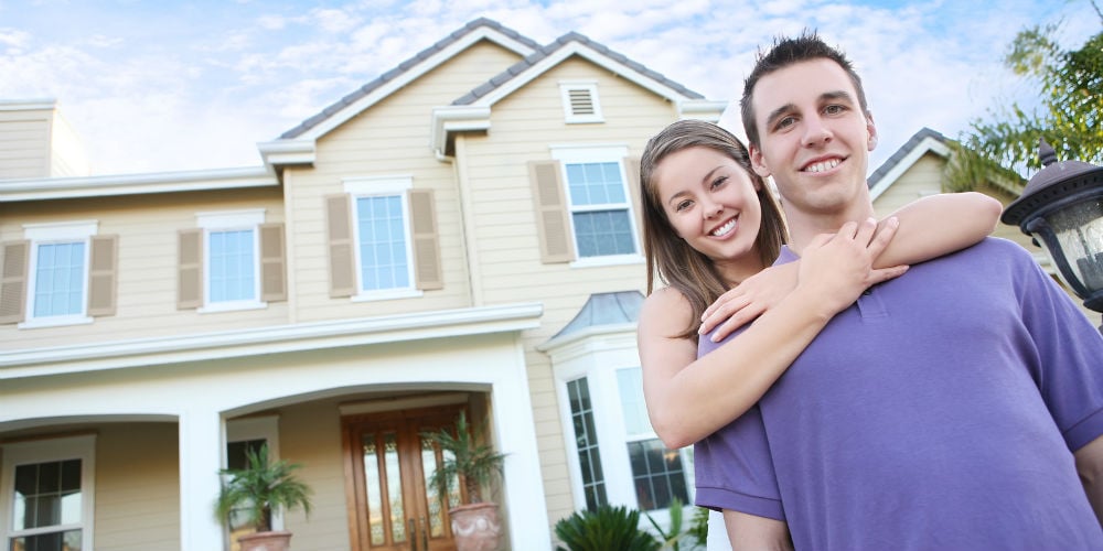 bigstock-Couple-In-Love-In-Front-Home-3918888