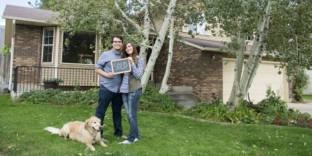 bigstock-Couple-outside-new-home-116702642