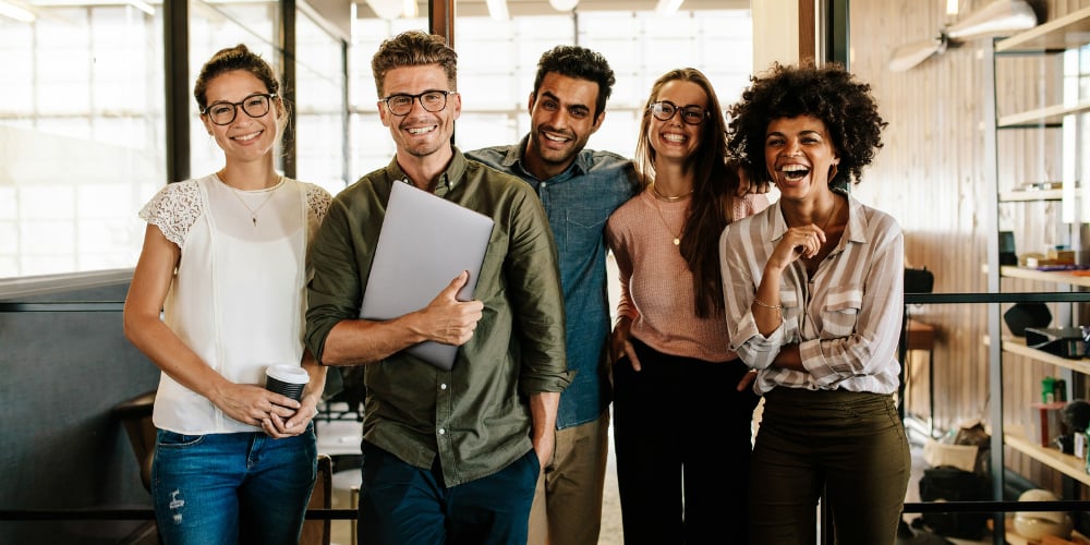bigstock-Creative-Business-Team-Laughin-178889233