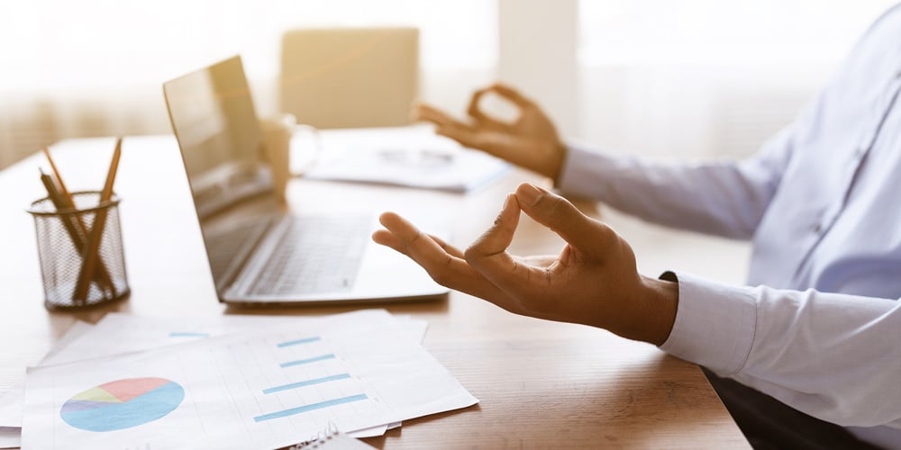 Cropped Of Unrecognizable Black Worker Meditating While Working In Office