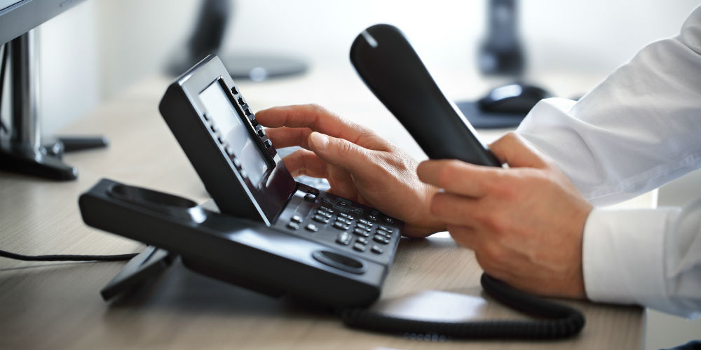 bigstock-Dialing-telephone-keypad-conce-86579804