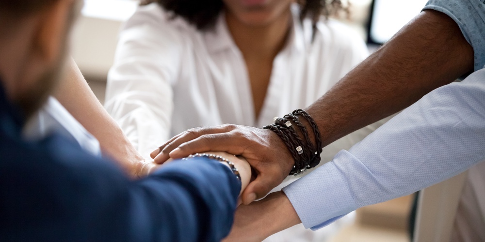 Diverse Business People Put Hands Together In Pile