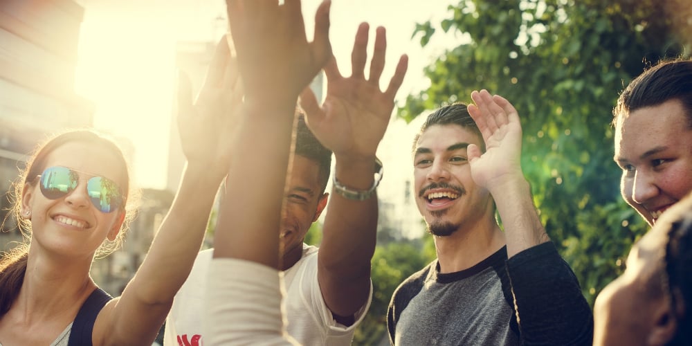 bigstock-Diverse-Group-People-High-Five-154507304
