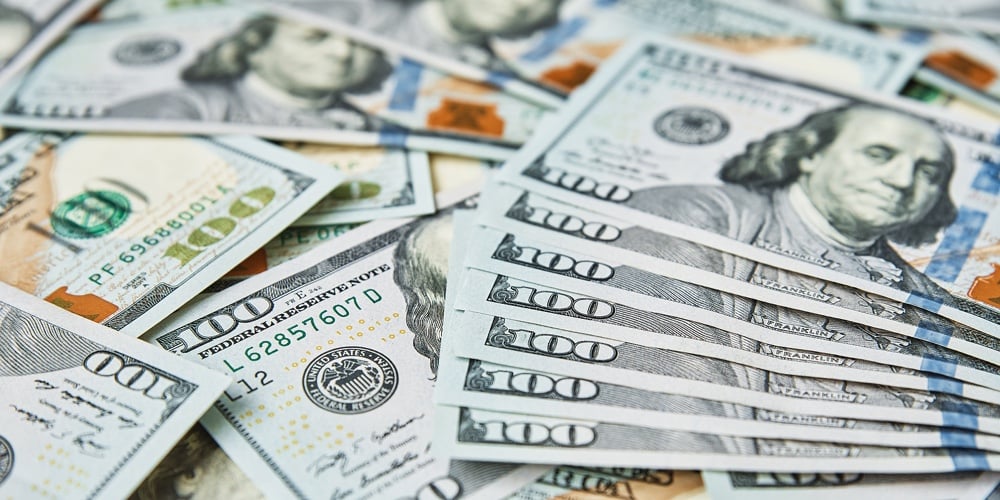 bigstock-Dollar-Bills-Background-Pile-421704959