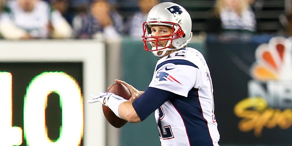 EAST RUTHERFORD, NJ – NOV 22: New England Patriots quarterback Tom Brady looks to throw a pass again