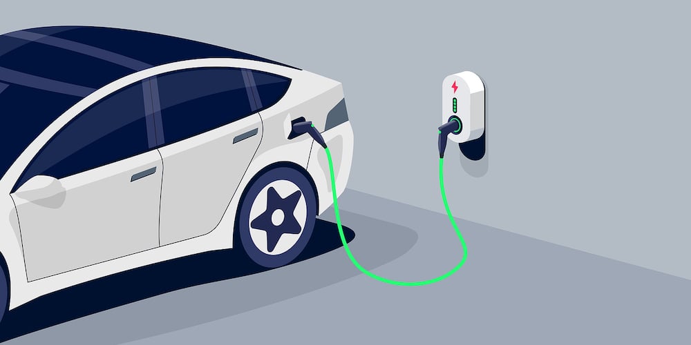 Electric Car Charging In Underground Garage Plugged To Home Charger Station. Battery Ev Vehicle Stan