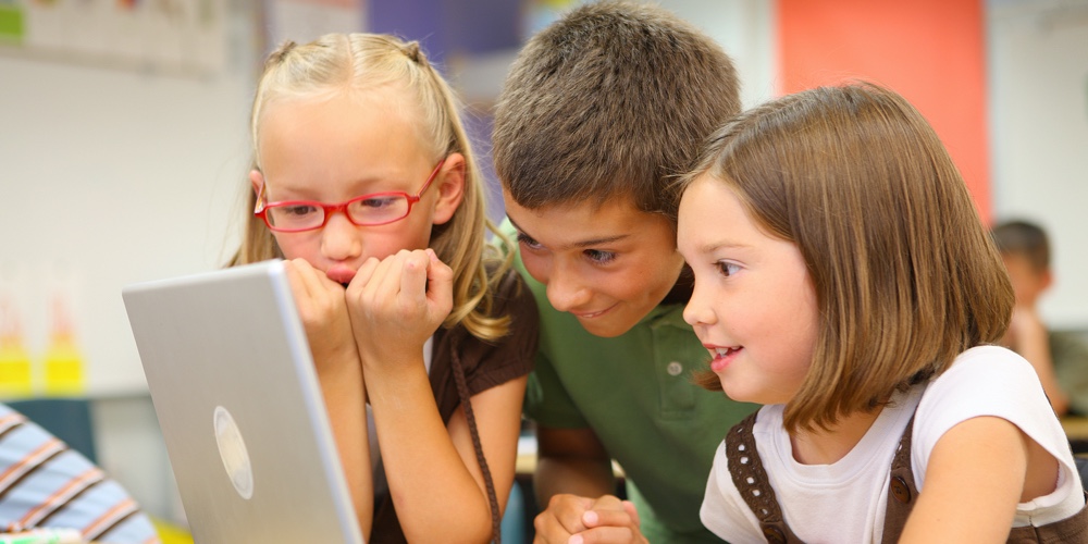 Wooden Pipe and Tobacco|Elementary school students looking at computer