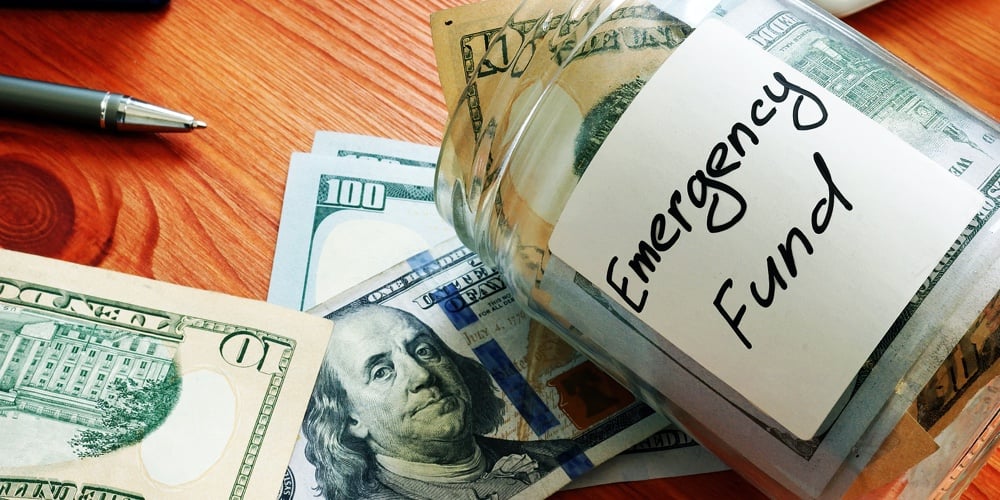 Emergency Fund In The Glass Jar With Cash.