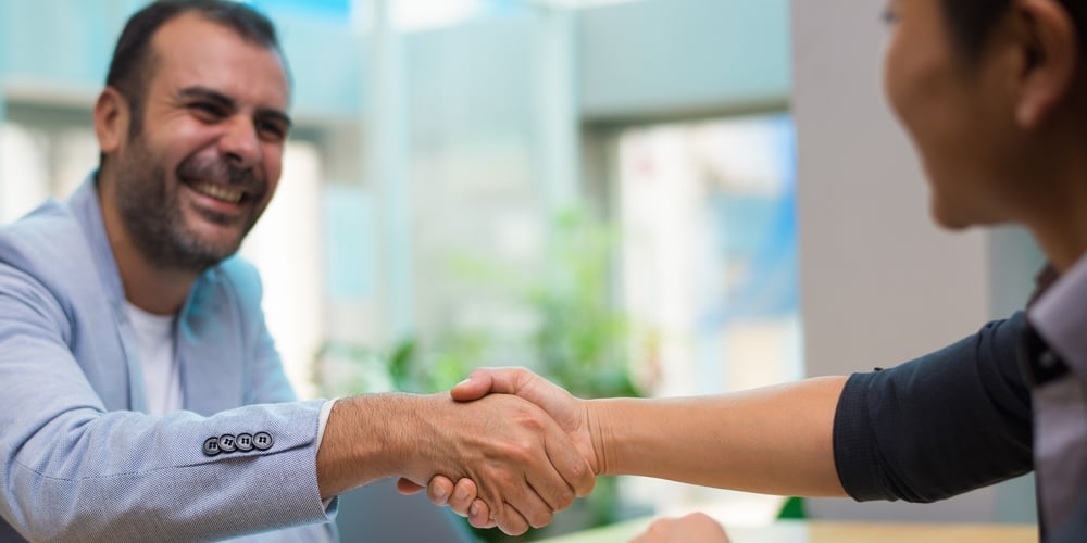 bigstock-Excited-Hispanic-Employer-Cong-263621821