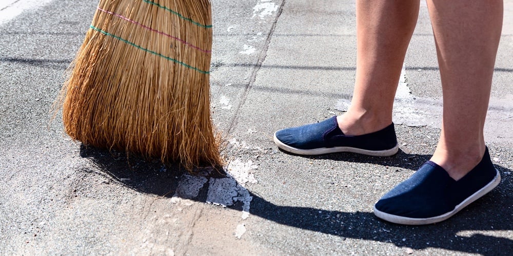 Exterior Cleaning With Corn Broom . Courtyard Floor Sweeping . Feet And Corn Broom
