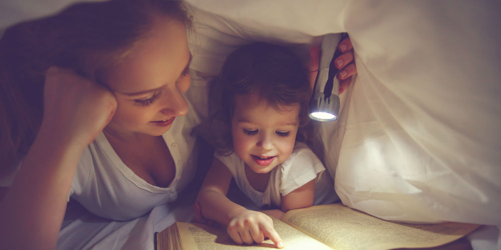 bigstock-Family-Reading-Bedtime-Mom-An-120539375