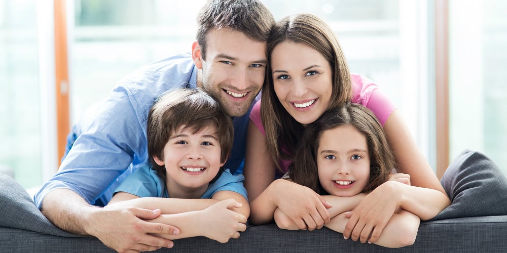 bigstock-Family-relaxing-on-sofa-90746759