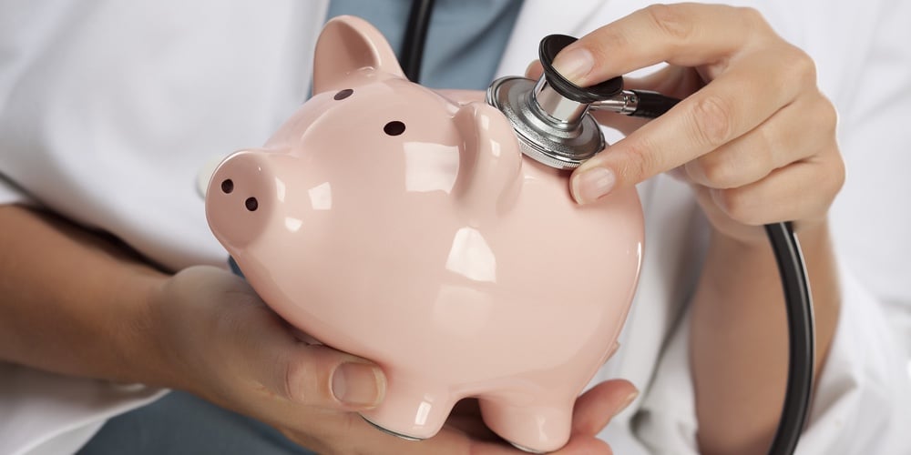 Female Doctor Holding Stethoscope to Pink Piggy Bank Abstract.