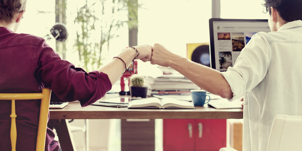 bigstock-fist-bump-colleagues-collabora-138988097