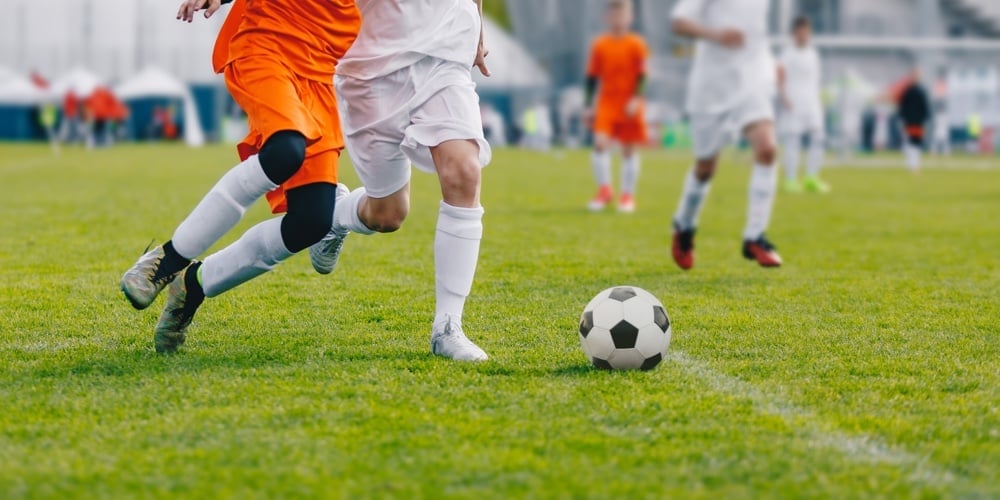 bigstock-Football-Game-Junior-Level-Bo-325080916