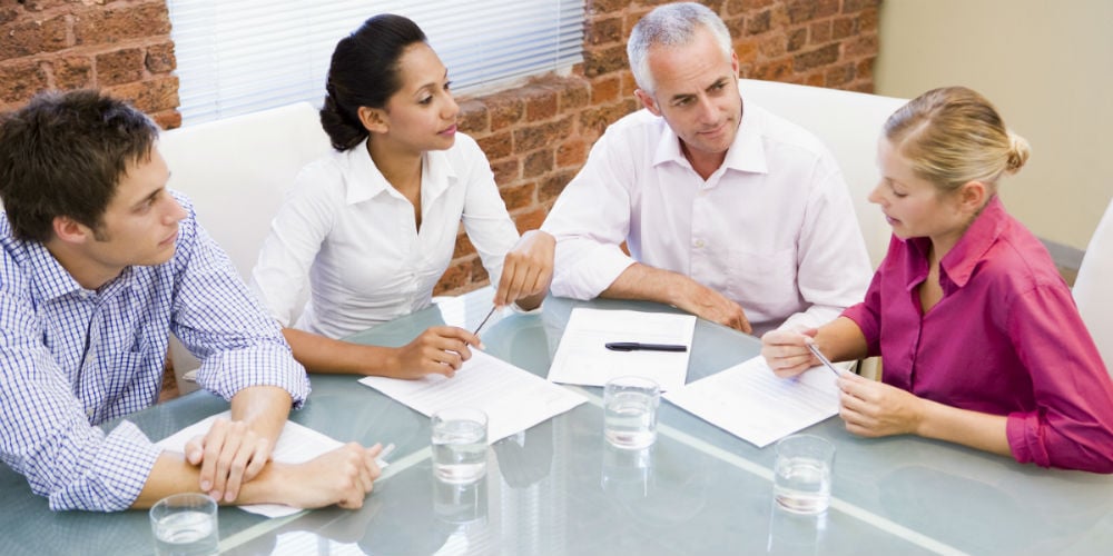 bigstock-Four-Businesspeople-In-Boardro-4132471