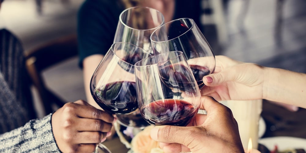 bigstock-Friends-Clinging-Wine-glasses-190183315