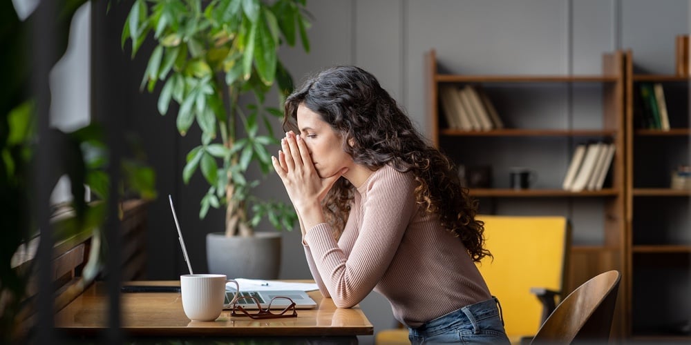Frustrated Sad Woman Feeling Tired Worried After Reading Email With Bad News Sitting At Table With L