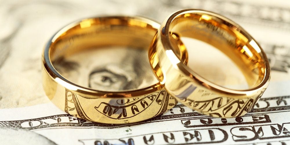 bigstock-Golden-wedding-rings-on-bankno-96581723-e1493763372984