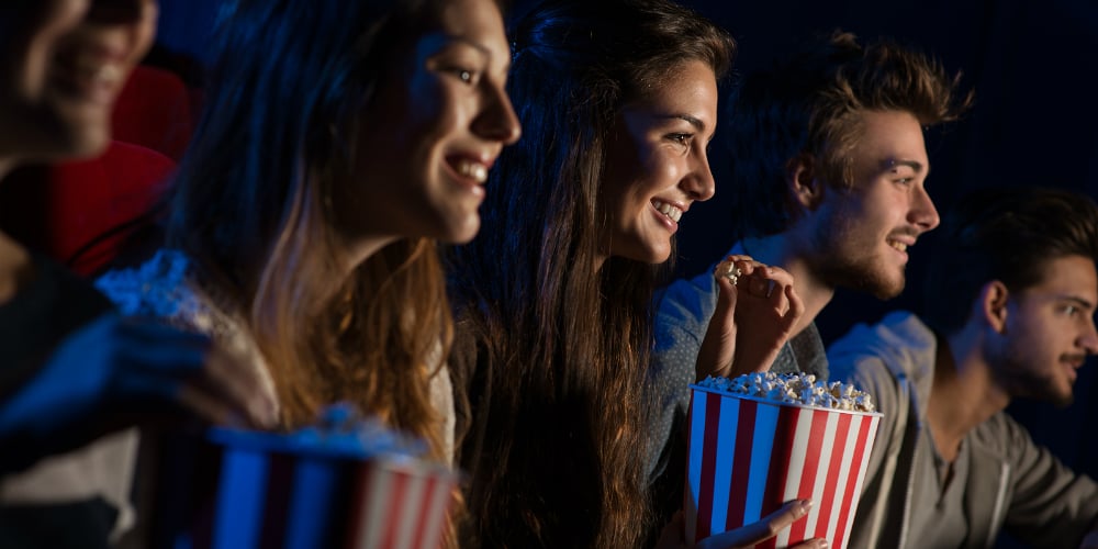 bigstock-Group-Of-Friends-In-The-Movie-116769887