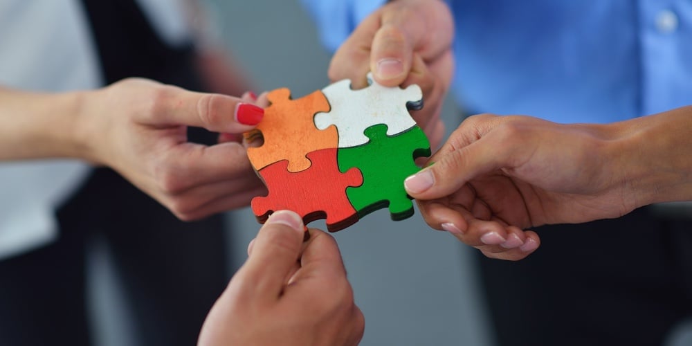 Group of business people assembling jigsaw puzzle and represent team support and help concept|Group of business people assembling jigsaw puzzle and represent team support and help concept