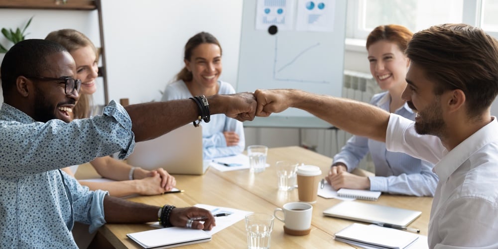 bigstock-Guys-Fist-Bumping-Congratulati-273078595