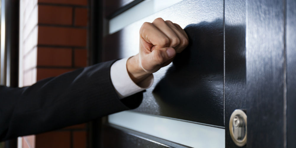 bigstock-Hand-Knocking-On-The-Door-74914648