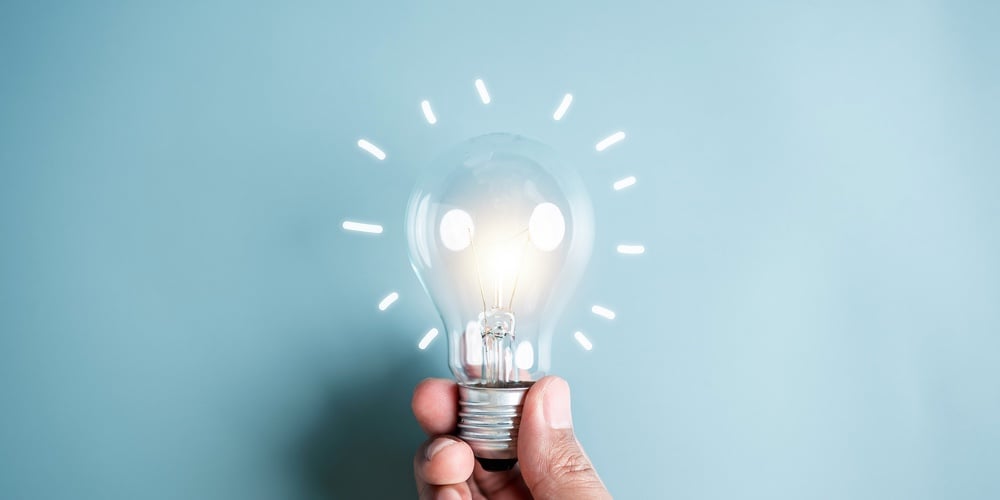 bigstock-Hand-Man-Holding-Illuminated-L-471920401