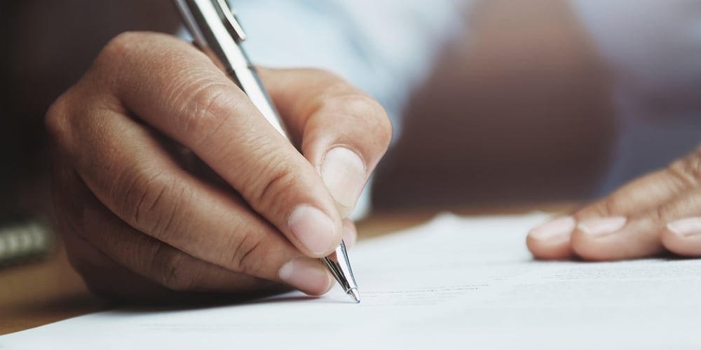 bigstock-Hand-Of-Woman-Holding-Pen-With-286245913