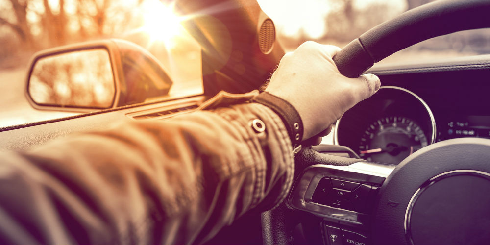 bigstock-Hand-On-Wheel-Car-Driving-80256233