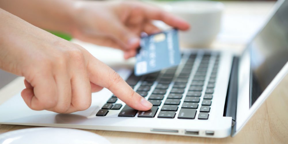 bigstock-Hands-holding-a-credit-card-an-713133011