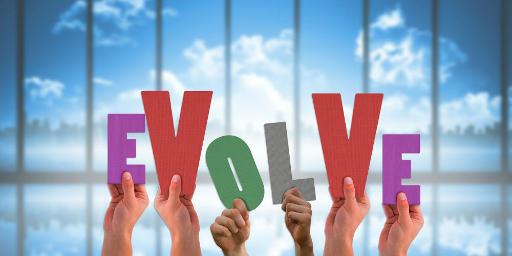 bigstock-Hands-holding-up-evolve-agains-86896694