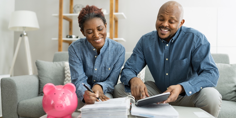 Happy African Couple Doing Retire Finances Plan And Money Budget