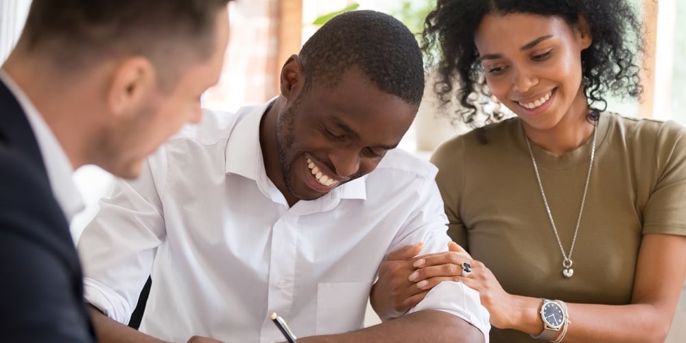 Happy African Family Couple Customers Sign Mortgage Loan Insurance Contract