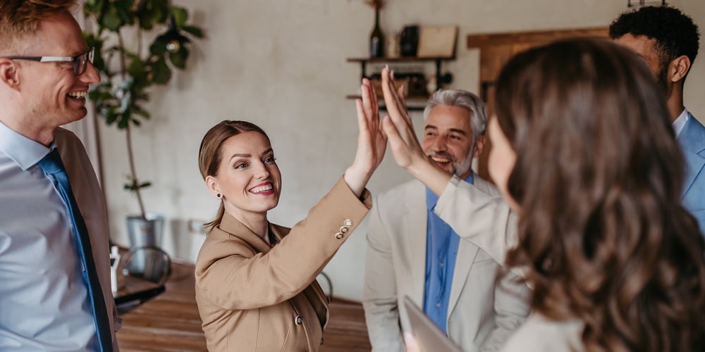 CU_Diff.jpeg|Happy Business Team Giving A High Fives Gesture As They Laugh And Celebrating Their Success