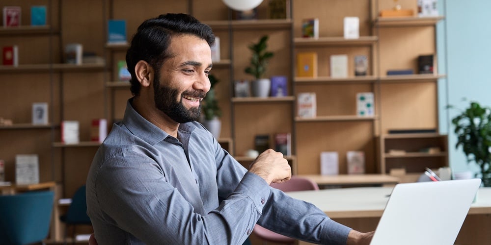 Happy Indian Professional Young Adult Man Having Video Conference Call Virtual Business Meeting Work