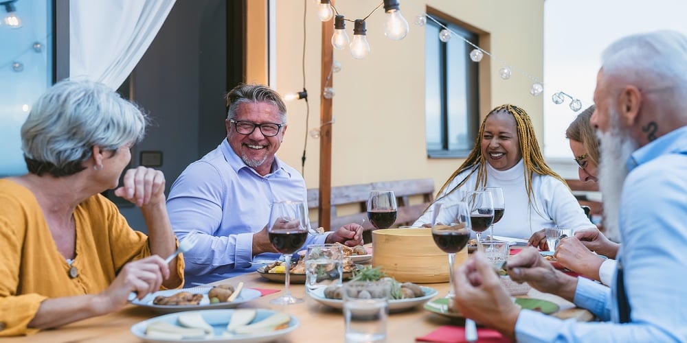 Happy Multiracial Senior Friends Having Fun Dining Together On House Patio – Elderly Lifestyle Peopl