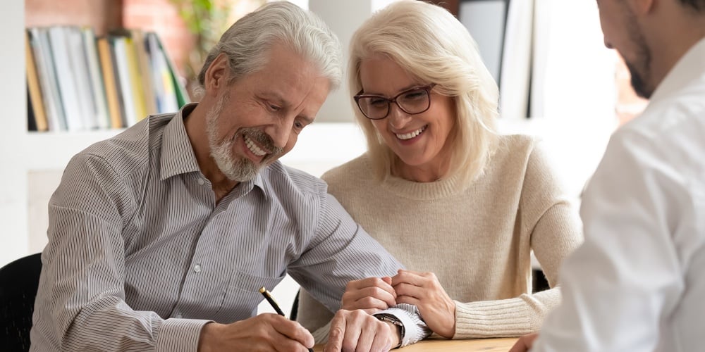 Happy Older Couple Clients Sign Insurance Contract Meeting Agent